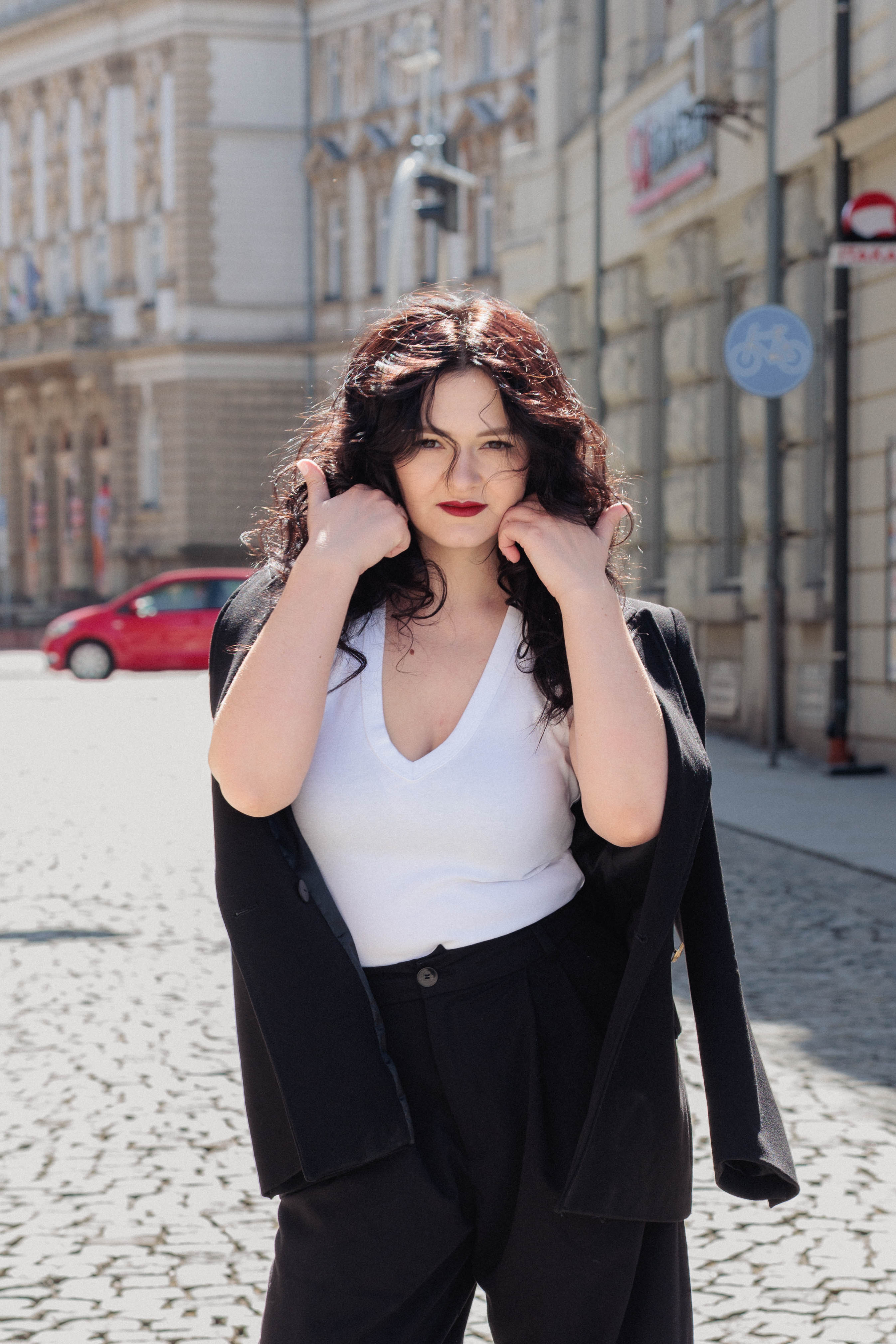 A couple stands closely in an intimate embrace.