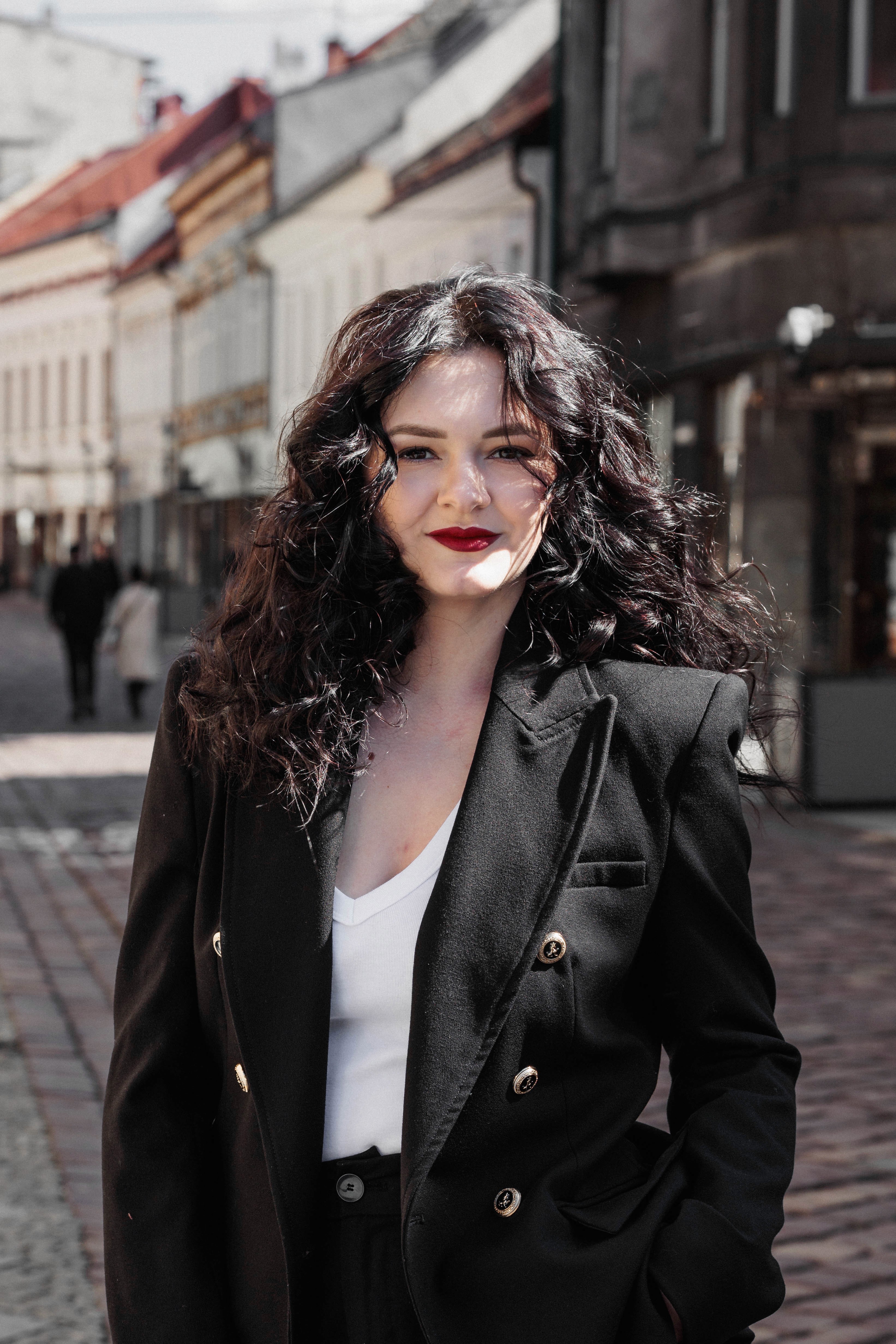 A couple stands closely in an intimate embrace.